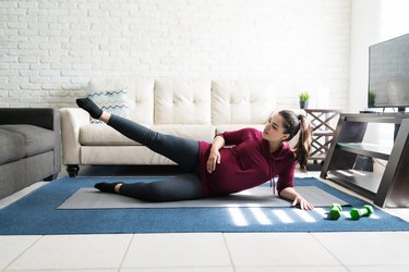 Attractive Expectant Woman Doing Stretching Exercise