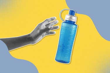 A black and white hand reaching for a water bottle, representing the effects of dehydration
