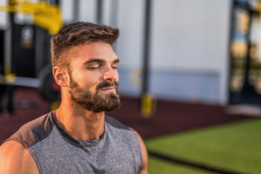 young man in the gym breathing through his nose during a breath-based interval workout